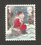 Stamps Europe - United Kingdom -  navidad, papa noel sentado en la chimenea