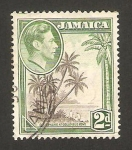 Stamps America - Jamaica -  george VI, cocoteros de la bahia de colomb