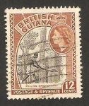 Stamps Europe - Guyana -  Guyana británica - indígena talando arboles
