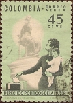 Sellos de America - Colombia -  Derechos Políticos de la Mujer (Madre y niño en las urnas con monumento).