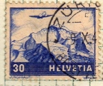 Stamps Switzerland -  Avion sobrevolando montañas