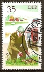 Stamps Germany -  Conductor de tractor rescata a un cervatillo-DDR