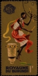 Stamps Burundi -  Nativo bailando. Fondo dorado.