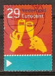 Stamps : Europe : Netherlands :  Navidad. Manos que sostienen los vidrios autoadhesivas.