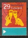 Stamps Netherlands -  Navidad. Manos que sostienen los vidrios autoadhesivas.