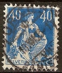 Stamps Switzerland -  Helvetia, sentado con las montañas en el fondo.