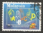 Sellos de Asia - Malasia -  452 - Año internacional de la alfabetización, signos para sordo-mudos