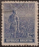 Stamps Argentina -  Labrador surcando la tierra con arado de mano. Sol naciente.  1912 12 centavos