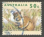 Stamps Australia -  La rana naranja thighed  es una rana arbórea originaria de una pequeña área  tropical del norte de Q