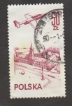 Stamps Poland -  Avión sobrevolando ciudad