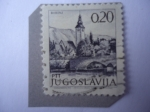 Stamps Yugoslavia -  Iglesia y Puente en Bohinj.