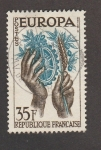 Stamps France -  Manos sosteniendo rama olivo y engranaje