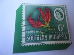 Stamps : Africa : Zambia :  Queen Elizabeth II- Lirio de Fuego- Southern Rhodesia (Rodesia)