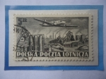 Stamps Poland -  Correo Aéroa Polaco-Avión Ilyushin II-12 sobrevolando a Nowa Huta. Sello de 5 zloty Polaco año1952.