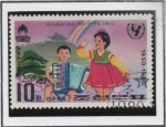 Stamps North Korea -  Dia internacional d' niño: niños tocando la Acordeon