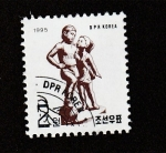 Stamps North Korea -  Niños poniendo el pie sobre un bslón
