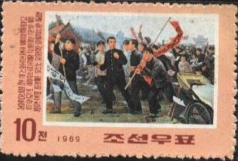 Luchas por la reunificación de Corea. KIM Il SUNG y seguidores con banderas.