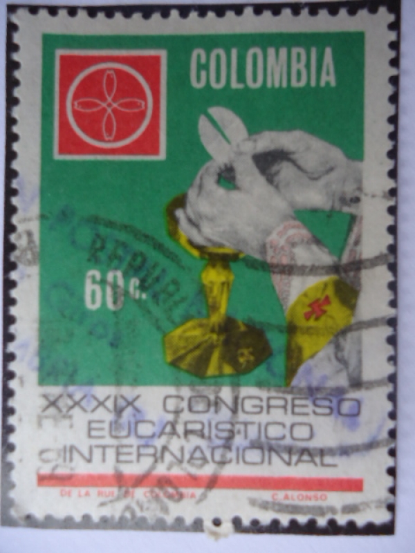 XXXIX Congreso Eucarístico Internacional - Manos del Sacerdote y Emblema del Congreso.