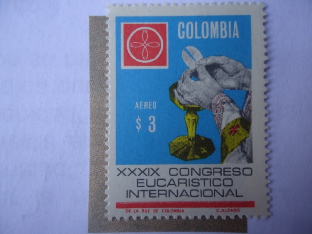 XXXIX Congreso Eucarístico Internacional, Bogotá - Manos del Sacerdote y Emblema del Congreso.