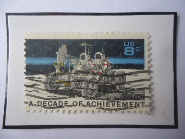 A Decade of Achievement-Lunar Rover and Astronauts- Una Década de Logros-Rover Lunar y Astronautas.
