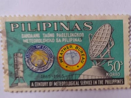Ciclo Meteorológico de Cien Años en Filipinas (1865-1965)-Emblema del Observatorio y oficina en Mani