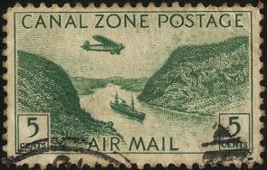 CANAL ZONE. Aeroplano sobre el canal de Panamá y barco navegando.